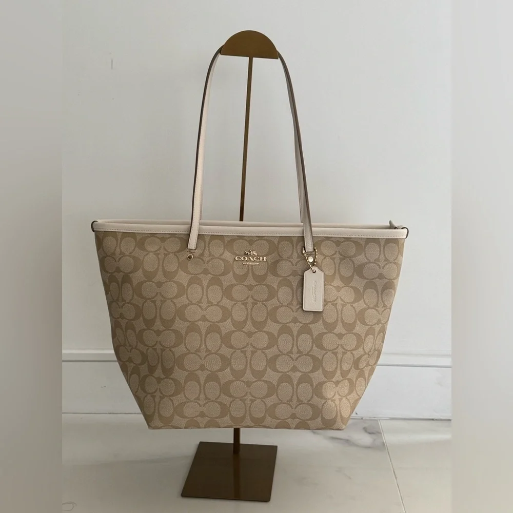 Coach Signature Light Khaki Zip Tote with three inside pockets 17”W x 11”H x 6”D